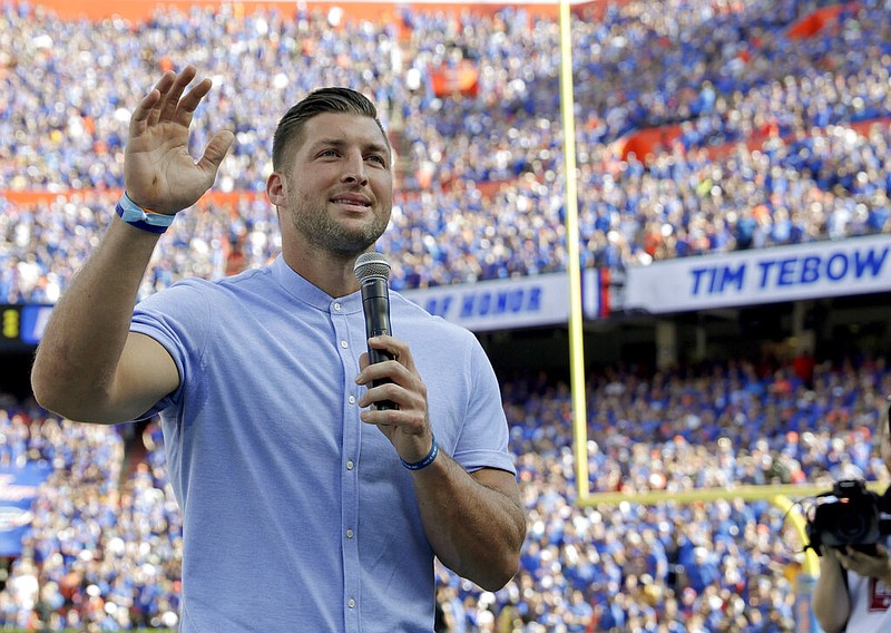 Former Florida football player Tim Tebow speaks to fans after he was inducted in the Ring of Honor at Florida Field during the first half of an NCAA college football game against Louisiana State University in Gainesville, Fla., in this Saturday, Oct. 6, 2018, file photo. (AP/John Raoux, File)