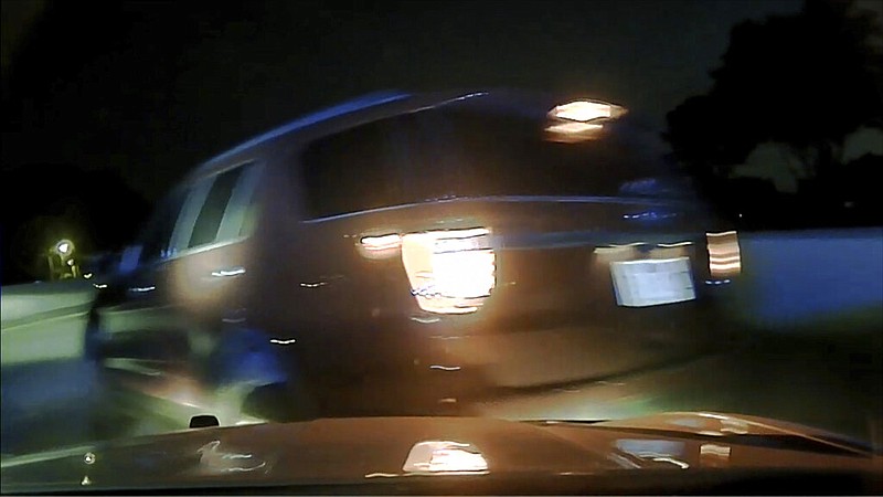 This screen shot taken from dashcam video owned by the Arkansas State Police shows the moment before a car driven by Janice Nicole Harper flipped over in Pulaski County in July 2020. The dashcam was in a vehicle driven by Arkansas State Police trooper Rodney Dunn. (Arkansas State Police via AP)