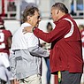 Alabama head coach Nick Saban, left, greets Arkansas head coach Sam Pittman before an NCAA college football game, Saturday, Nov. 20, 2021, in Tuscaloosa, Ala. (AP Photo/Vasha Hunt)
