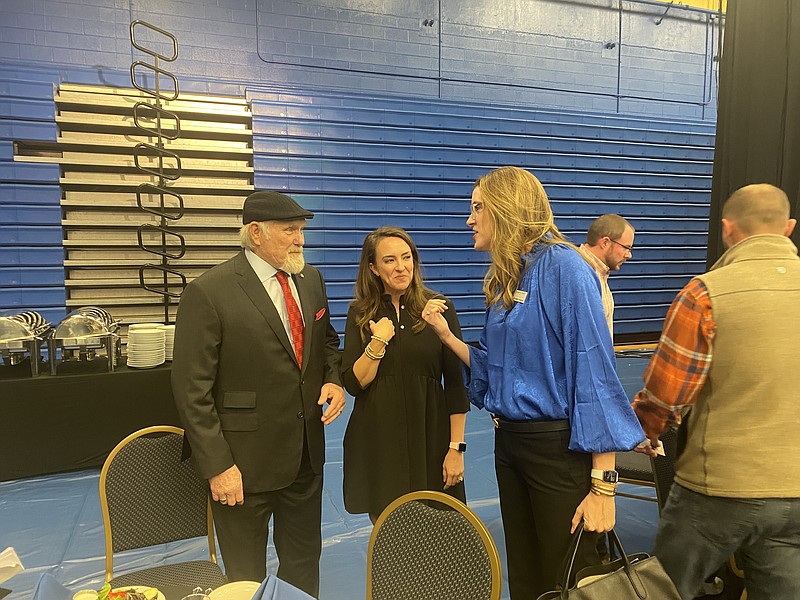 Terry Bradshaw talks with Rebecca Burns Gosnells, center, and Elizabeth Burns Anderson before the 2021 Farmers Bank & Trust Distinguished Speaker Series Tuesday night at Southern Arkansas University. (Becky Bell/Special to the Banner News)