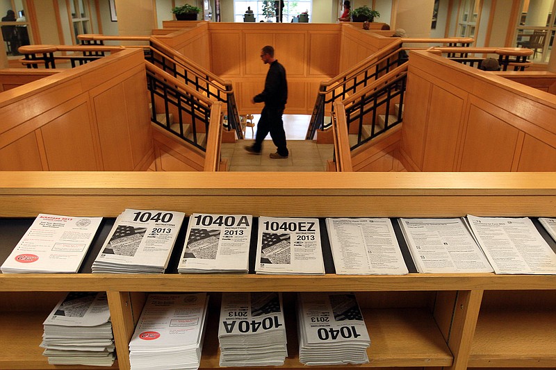 Income tax forms are shown in the Main Library in downtown Little Rock in this April 14, 2014, file photo. (Arkansas Democrat-Gazette file photo)