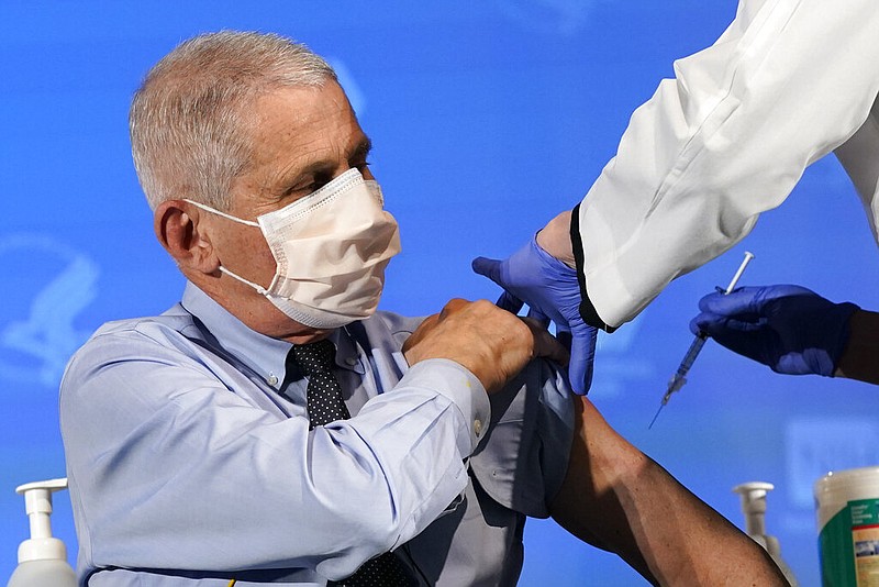 Dr. Anthony Fauci, director of the National Institute of Allergy and Infectious Diseases, prepares to receive his first dose of covid-19 vaccine at the National Institutes of Health in Bethesda, Md., in this Dec. 22, 2020, file photo. (AP/Patrick Semansky, Pool)