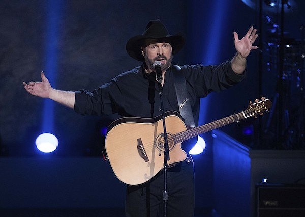 In this March 4, 2020, file photo, country star Garth Brooks performs on stage during the 2020 Gershwin Prize Honoree's Tribute Concert at the DAR Constitution Hall in Washington. (Photo by Brent N. Clarke/Invision/AP)