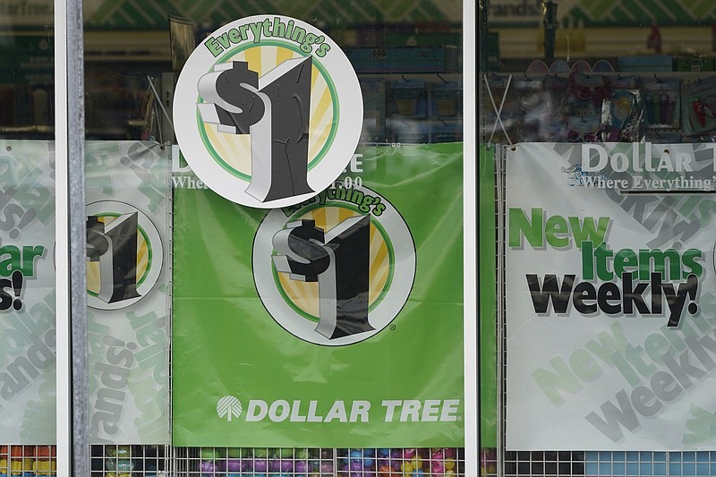 Dollar Tree store logos promoting a $1 price on everything in the store fill a storefront window in Jackson, Miss., in this file photo. Faced with the rising cost of goods and freight, discount retail chain Dollar Tree said Tuesday that it will be raising its prices to $1.25 for the majority of its products.
(AP)