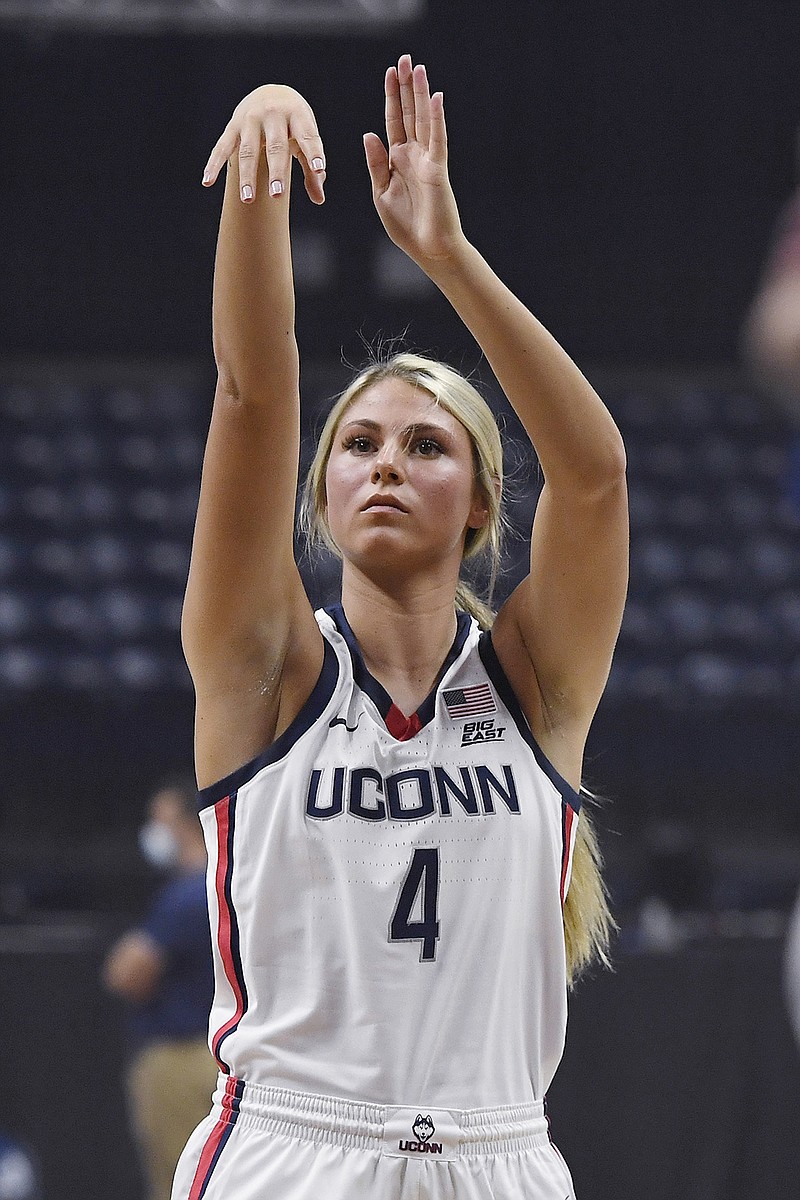 Connecticut's Saylor Poffenbarger shoots during UConn's men's and women's basketball teams annual First Night celebration, Friday, Oct. 15, 2021, in Storrs, Conn. (AP Photo/Jessica Hill)