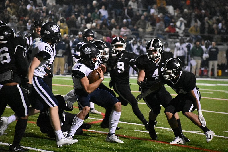 White Hall defenders Tekaylin Walker (9), Grey Shaner (43) and Braylon Johnson attempt to tackle Little Rock Christian quarterback Walker White during Friday night’s Class 5A semifinal game at Bulldog Stadium in White Hall.
(Pine Bluff Commercial/I.C. Murrell)