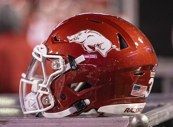An Arkansas football helmet is shown on a trunk on Friday, Nov. 26 2021, during the second half of play at Reynolds Razorback Stadium in Fayetteville.