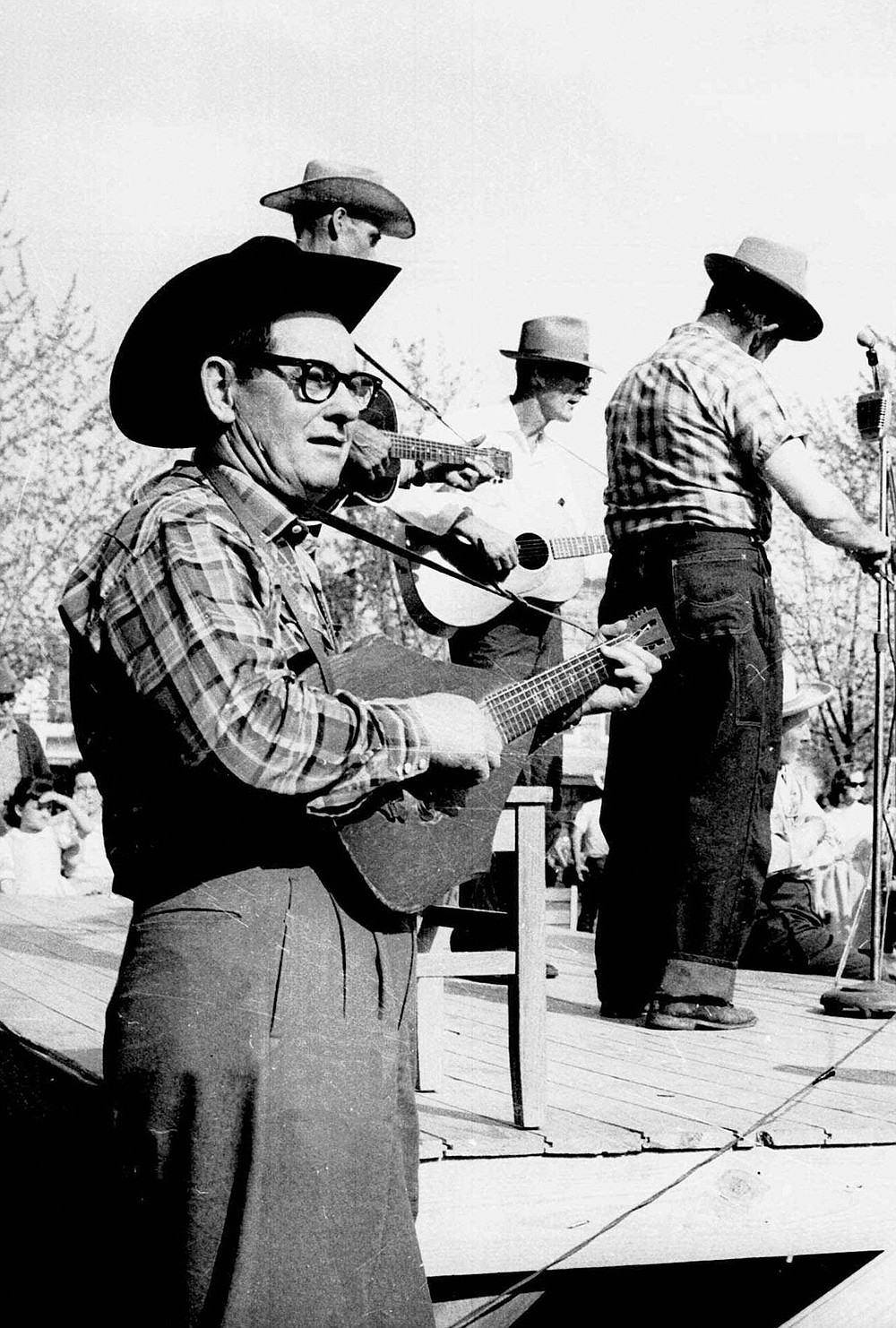 Folksinger-songwriter Jimmy Driftwood keeps watch over the Arkansas Folk Festiveal in Mountain View in this July 26, 1964 file photo.
(AP)