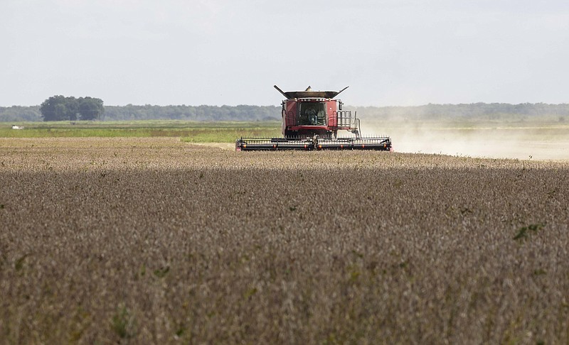 A farmer harvest soybeans in Lonoke County in this Sept. 16, 2020, file photo. (Arkansas Democrat-Gazette/Staton Breidenthal)