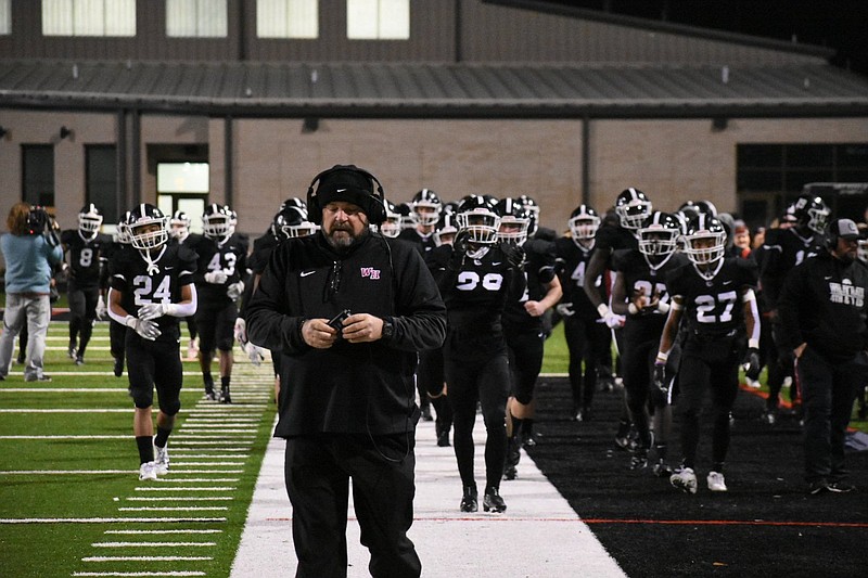 White Hall High School Coach Bobby Bolding leads the Bulldogs onto their home field for their 5A state semifinal win over Little Rock Christian Academy on Nov. 26. 
(Pine Bluff Commercial/I.C. Murrell)