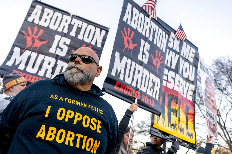 Anti-abortion protesters surround abortion rights advocates as both groups demonstrate in front of the U.S. Supreme Court, Wednesday, Dec. 1, 2021, in Washington, as the court hears arguments in a case from Mississippi, where a 2018 law would ban abortions after 15 weeks of pregnancy, well before viability. (AP/Andrew Harnik)