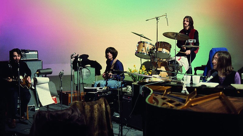 Paul McCartney, George Harrison, Ringo Starr and John Lennon hang out on a soundstage at Twickenham Film Studios where they’re rehearsing for their first live concert since 1966 in this scene from Peter Jackson’s new documentary “The Beatles: Get Back.”