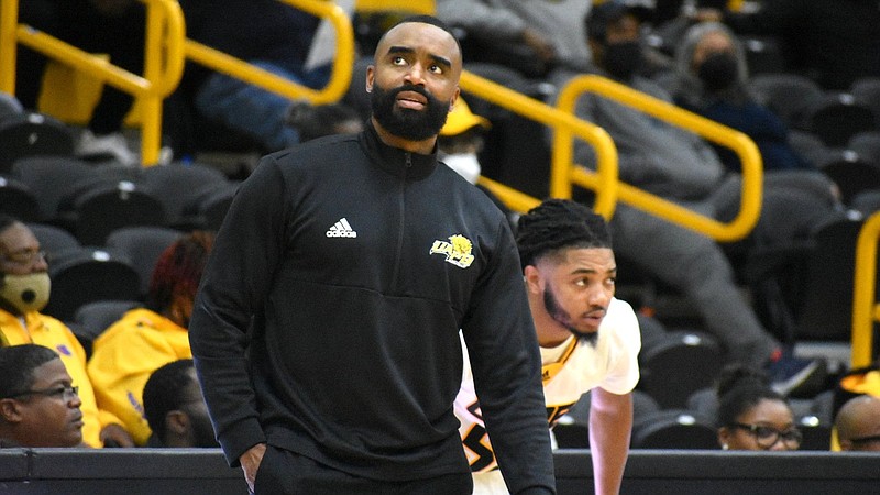 UAPB men’s basketball Coach Solomon Bozeman looks up, with guard Shawn Williams behind him, during Monday’s home game against Arkansas Baptist College. 
(Pine Bluff Commercial/I.C. Murrell)
