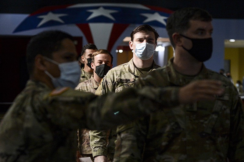 Soldiers line up for a medical screening before getting the coronavirus vaccine at Fort Bragg, N.C., in February. The Army says about 4% of its active force, about 19,000 soldiers, have not been vaccinated.
(The New York Times/Kenny Holston)