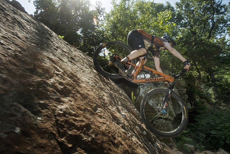 NWA Democrat-Gazette/BEN GOFF @NWABENGOFF.Vincent Edwards, rides coordinator for Ozark Off Road Cyclists, rides the Coyote Cave trail Friday, July 20, 2018, at Fitzgerald Mountain in Springdale.