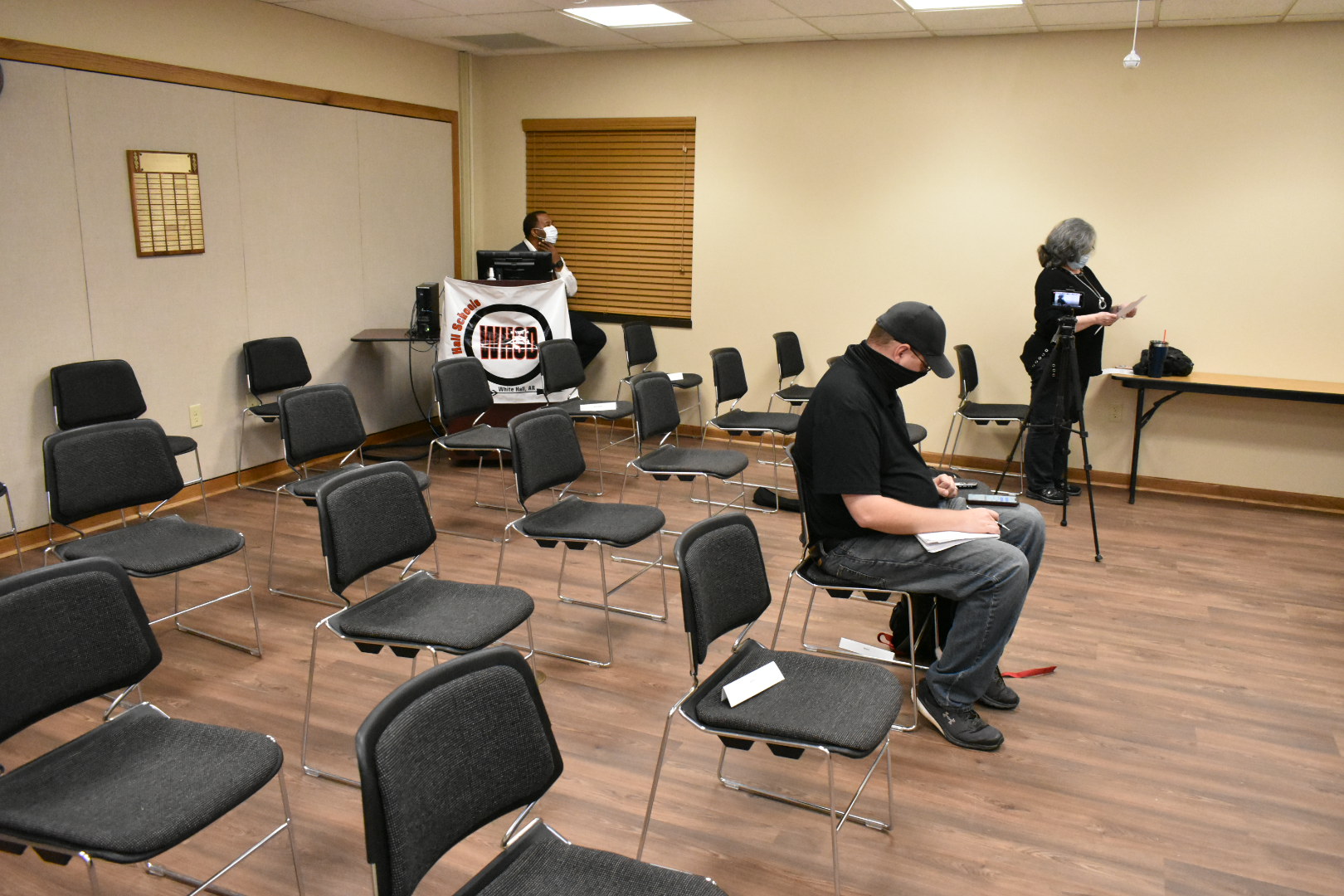 School masks hearing mostly void of people