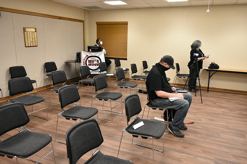 The White Hall School District boardroom is nearly empty as high school science teacher Teena Jeffers (right) addresses the school board during a hearing over the district mask mandate Thursday, Dec. 2, 2021. 
(Pine Bluff Commercial/I.C. Murrell)