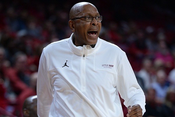 FILE — Little Rock coach Darrell Walker directs his players on Saturday, Dec. 4, 2021, during the first half of play against Arkansas in Bud Walton Arena in Fayetteville.