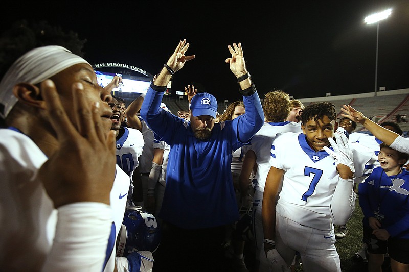 Bryant head coach Buck James celebrates with his players after Bryant's 42-38 win in the Class 7A state championship game on Saturday, Dec. 4, 2021, at War Memorial Stadium in Little Rock. .(Arkansas Democrat-Gazette/Thomas Metthe)