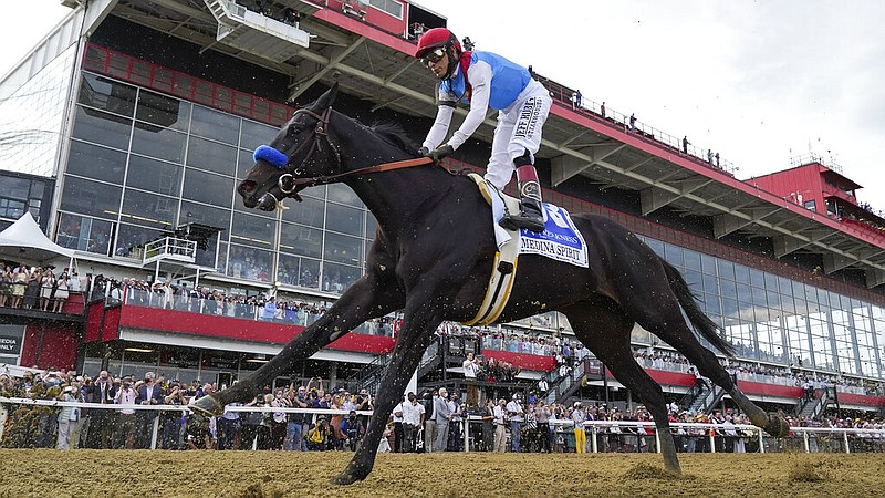 FILE - John Velazquez atop Medina Spirit competes during the 146th Preakness Stakes horse race at Pimlico Race Course, Saturday, May 15, 2021, in Baltimore. (AP/Julio Cortez, File)