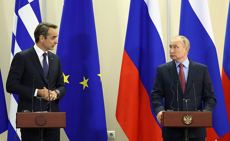 Russian President Vladimir Putin (right) and Greek Prime Minister Kyriakos Mitsotakis hold a news conference Wednesday after their talks in Sochi, Russia. Putin dismissed a question from journalists about whether Russia planned to attack Ukraine, calling the query “provocative.”