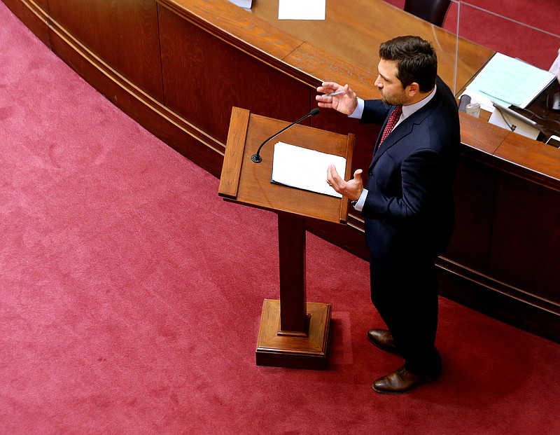 State Sen. Jonathan Dismang presents the Senate version of the bill to cut the top rates on individual income taxes and corporate income taxes, consolidate the state’s low- and middle-income tax tables, and create a nonrefundable low-income tax credit. More photos at arkansasonline.com/129session/.