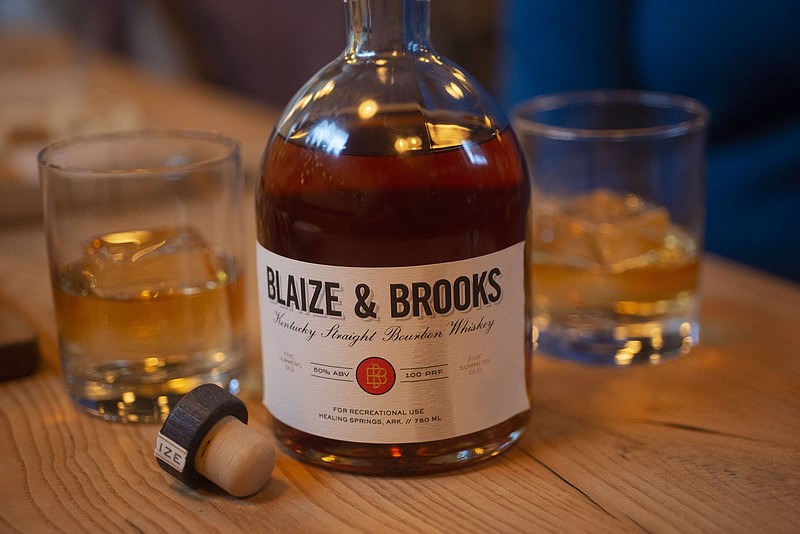 A bottle of Blaize & Brooks Homesick bourbon is displayed Tuesday at a Fayetteville restaurant.
(NWA Democrat-Gazette/J.T. Wampler)