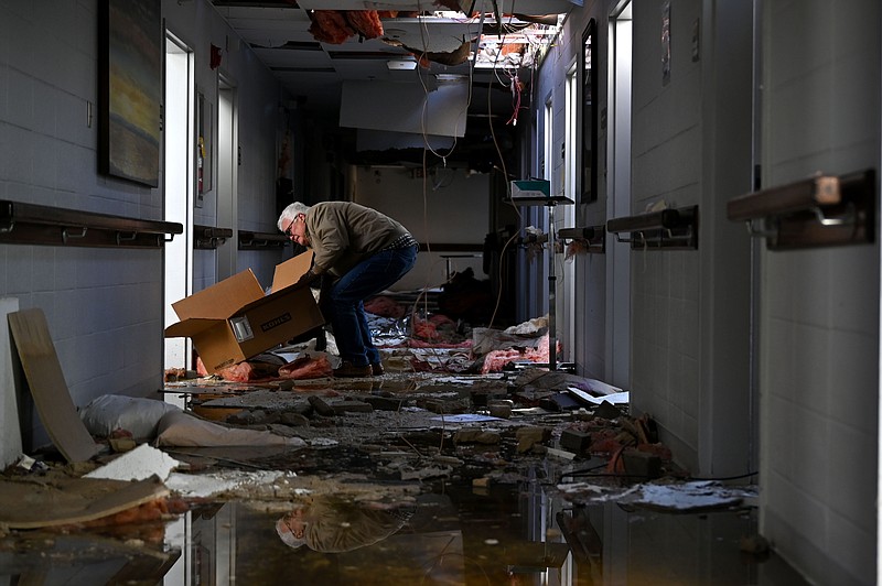 Ronnie Ford empties his mother-in-law's room at Monette Manor, a retirement home in Monette, on Sunday, Dec. 12, 2021. Ford's mother-in-law wasn't injured in the tornado that destroyed the retirement home on Friday night. See more photos at arkansasonline.com/1213tornado/..(Arkansas Democrat-Gazette/Stephen Swofford)