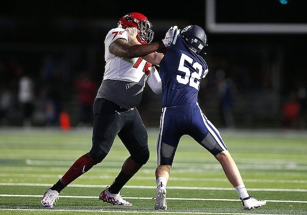 Maumelle offensive lineman Andrew Chamblee (72) blocks Little Rock Christian offensive lineman Jack Davis (52) during the first quarter of Maumelle's' 16-10 loss on Friday, Sept. 24, 2021, in Little Rock.