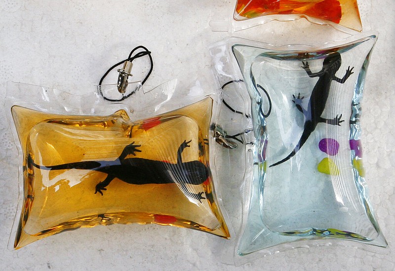 Plastic pouches containing young Chinese giant salamanders are shown in Beijing in this April 12, 2011, file photo. The pouches were sold by a vendor who claimed the liquid inside provides oxygen and nutrients for the amphibians. (AP Photo)