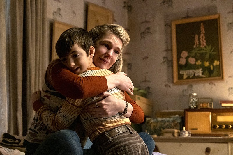 Young JR Moehringer (Daniel Ranieri) clings to his hardworking mother Dorothy (Lily Rabe) in George Clooney’s film version of the Pulitzer Prize-winning journalist’s memoir, “The Tender Bar.”