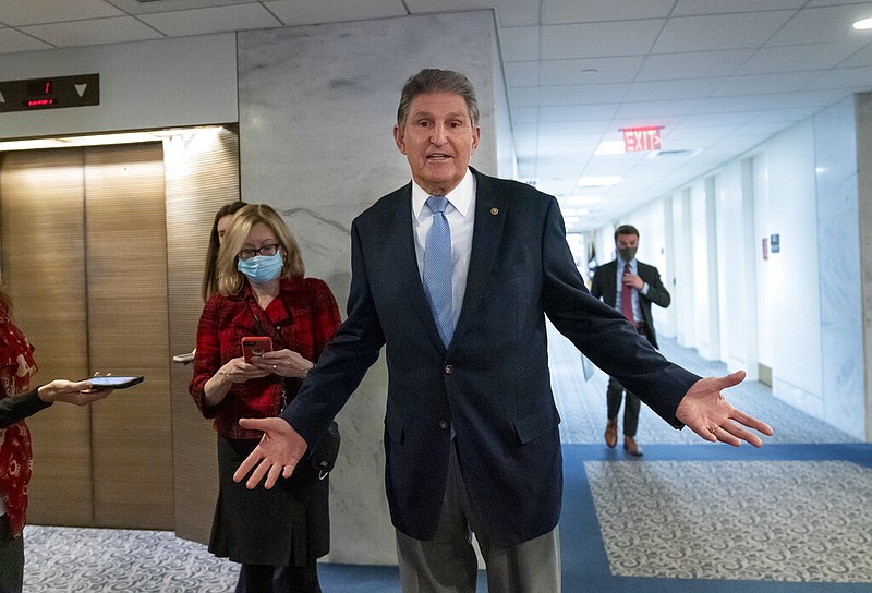 U.S. Sen. Joe Manchin, D-W.Va., leaves his office after speaking with President Joe Biden about the president's domestic agenda at the Capitol in Washington in this Dec. 13, 2021, file photo. Manchin has been reluctant to endorse the Biden administration’s expanded child tax credit program. (AP/J. Scott Applewhite)