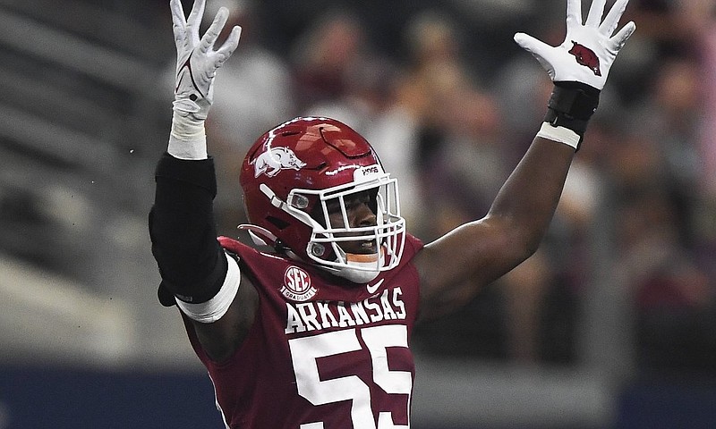 Arkansas defensive lineman Tre Williams (55) reacts after a tackle against Texas A&M at AT&T Stadium in Arlington, Texas, in this Sept. 25, 2021, file photo. (NWA Democrat-Gazette/Charlie Kaijo)