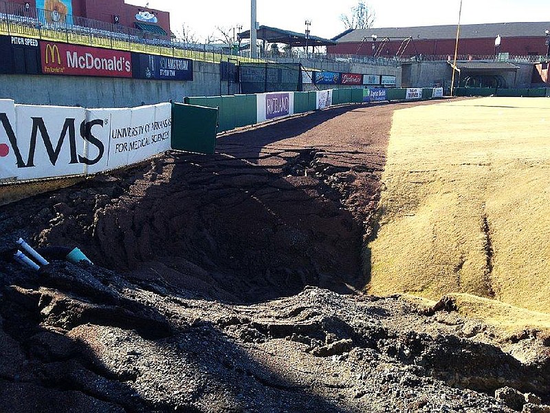 A sinkhole in the outfield of Dickey-Stephens Park in North Little Rock is shown in this submitted 2016 file photo. Sinkholes like this one, which was estimated to be 35 feet in diameter, have been blamed on problems with the drainage system at the baseball field, which is located near the Arkansas River. The city of North Little Rock owns Dickey-Stephens Park. (Special to the Arkansas Democrat-Gazette)