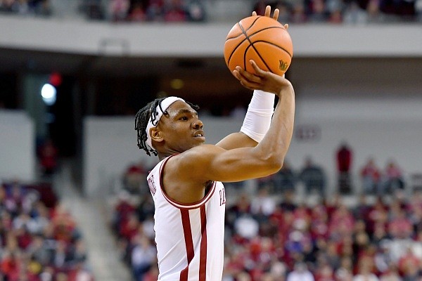 Arkansas guard JD Notae pulls up to shoot a three-pointer against Hofstra during the first half of an NCAA college basketball game on Saturday, Dec. 18, 2021, in Little Rock, Ark. (AP Photo/Michael Woods)