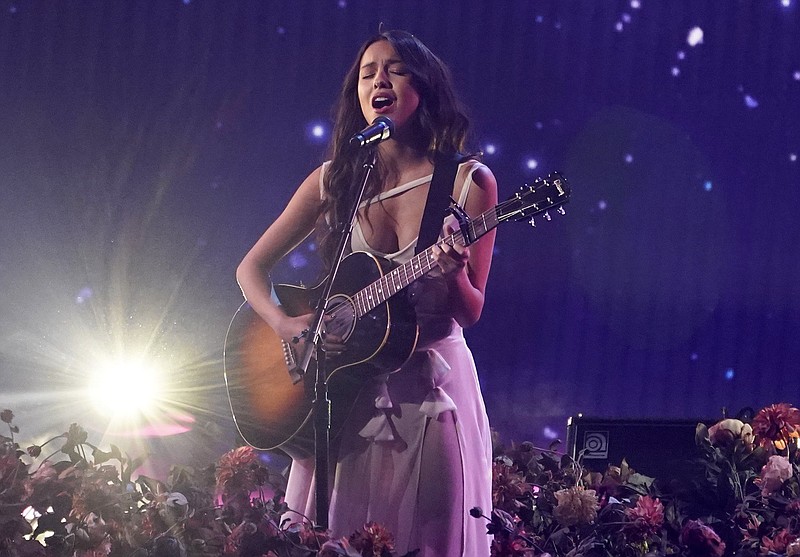 Olivia Rodrigo performs “Traitor” at the American Music Awards on Nov. 21. Her angry song about heartbreak, “Drivers License,” is one of the AP’s top 10 songs of the year. (AP Photo/Chris Pizzello)