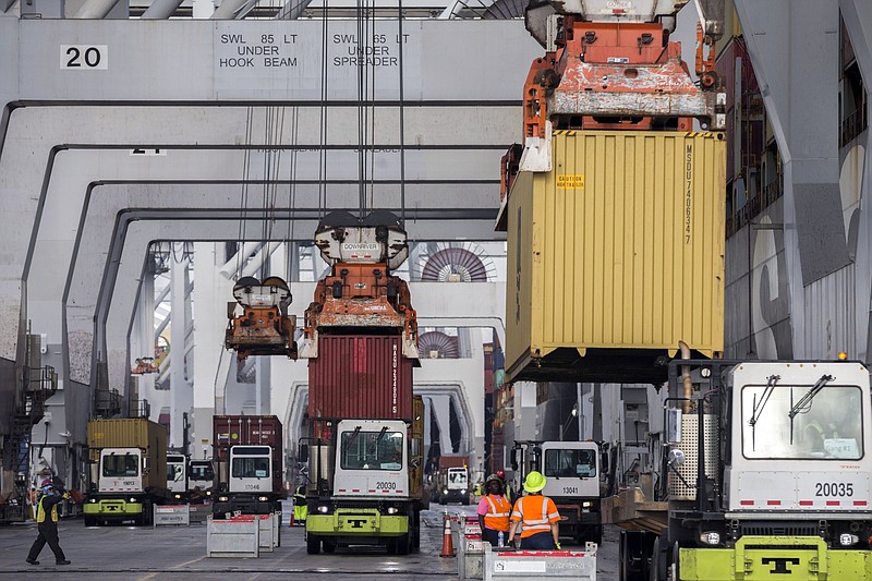 Ship-to-shore cranes load and unload containers from a cargo ship at the Georgia Ports Authority Garden City Terminal on Dec. 17, 2021, in Savannah, Ga.
(AP/Stephen B. Morton)