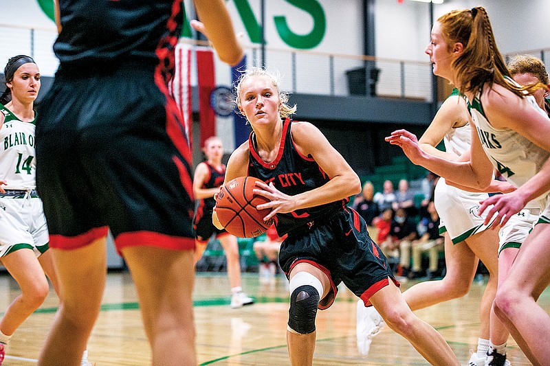 Addison Morgan of Jefferson City looks for an opening to make a pass during a game this season against Blair Oaks in Wardsville. (Ethan Weston/News Tribune)