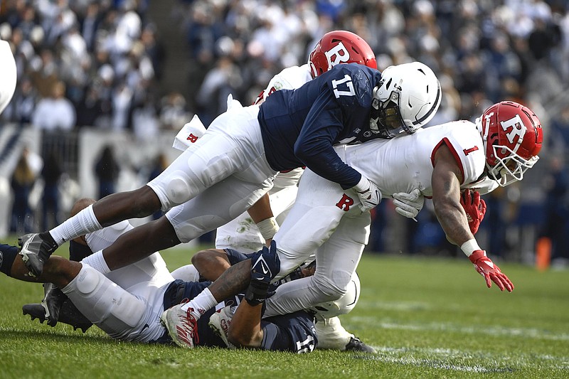 Penn State defensive end Arnold Ebiketie (17) tackles Rutgers running back Isaih Pacheco (1) during an NCAA college football game in State College, Pa.on Saturday, Nov. 20, 2021. Penn State shut out Rutgers 28-0. (AP Photo/Barry Reeger)