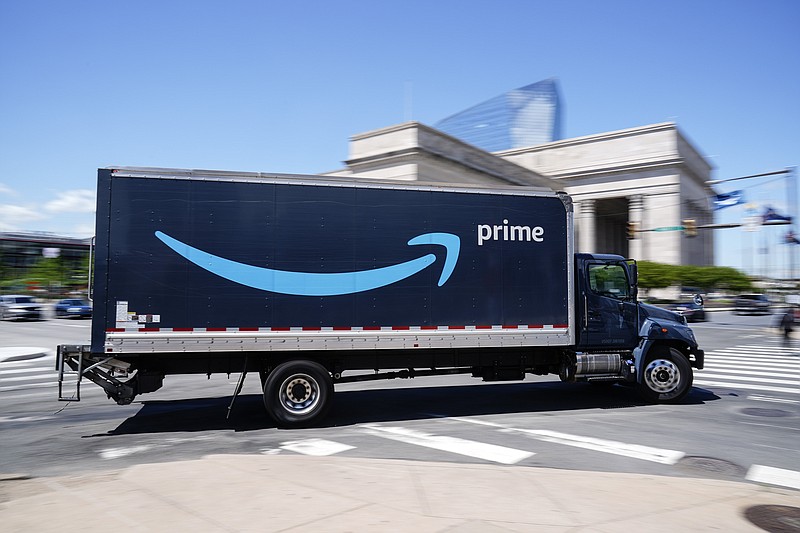 FILE — An Amazon truck drives in in Philadelphia, Friday, April 30, 2021. (AP Photo/Matt Rourke, file)