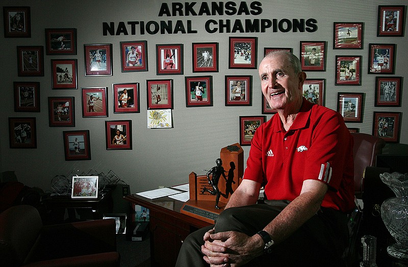 University of Arkansas Coach John McDonnell sits with one of 83 conference championship trophies in his office in 2008. He is among notable Arkansans who died this year. More photos at arkansasonline.com/1231lost/.
(Arkansas Democrat-Gazette file photo)