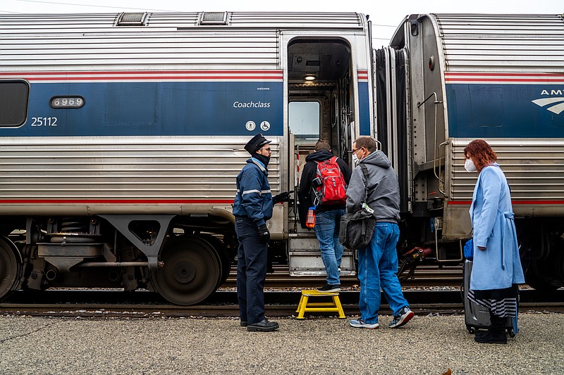 Passengers load Dec. 30 onto a westbound Amtrak Train at the Amtrak Station in Jefferson City. (Photo by Ethan Weston/News Tribune)