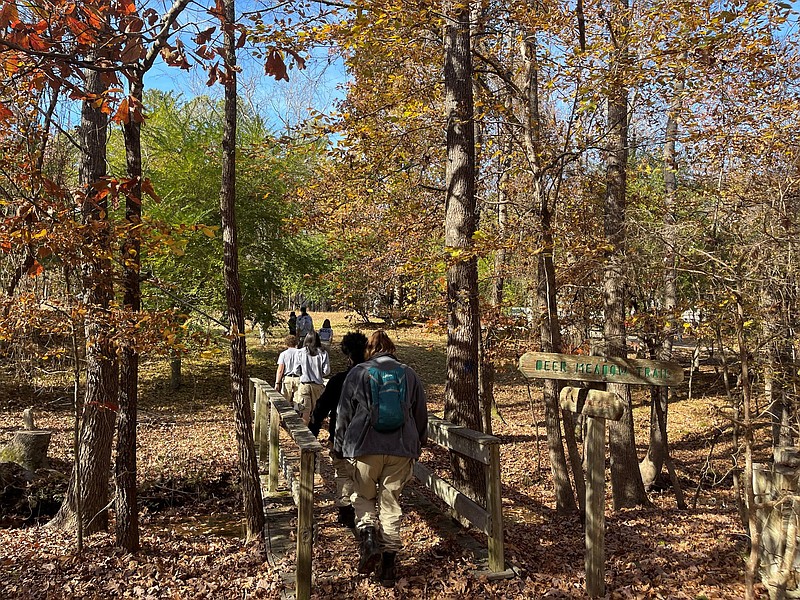 The group travels across a short bridge to the workshop on the 4-H campus. 
(Special to The Commercial/University of Arkansas System Division of Agriculture)