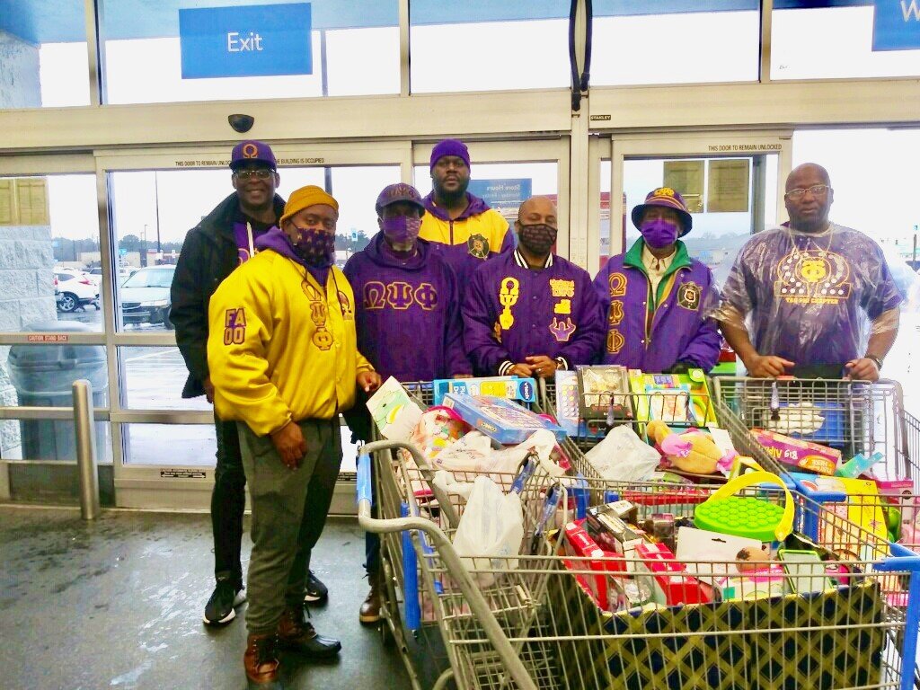Omegas use service day to give back to Pine Bluff area at 2 community events