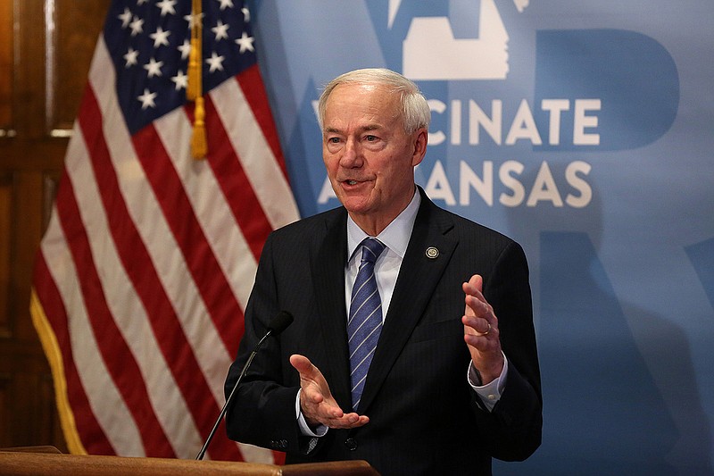 Gov. Asa Hutchinson answers a question during the weekly media briefing on Tuesday, Dec. 14, 2021, at the state Capitol in Little Rock. .More photos at www.arkansasonline.com/1215gov/.(Arkansas Democrat-Gazette/Thomas Metthe)