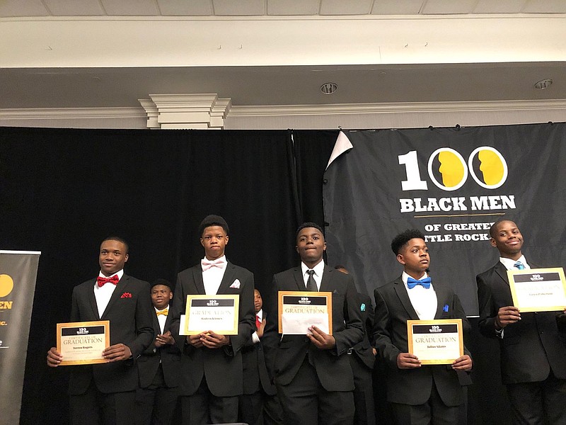 Gradates of the 100 Academy S.M.A.R.T. mentoring program show their certificates at the 2021 Christmas Gala hosted by 100 Black Men of Greater Little Rock Inc. The event, also honoring the 10th graduating class and including a pinning ceremony for new members, took place Dec. 17 in the DoubleTree Hotel Ballroom in Little Rock.
(Arkansas Democrat-Gazette/Helaine R. Williams)