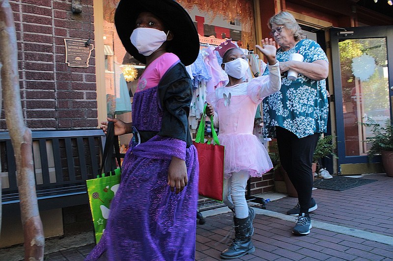 OCTOBER: Trick-or-treaters swarmed the streets of El Dorado for Halloween, including Aryanna and Mathia Williams. Scare on the Square downtown helped provide a safe place for trick-or-treaters to roam. (Caitlan Butler/News-Times)