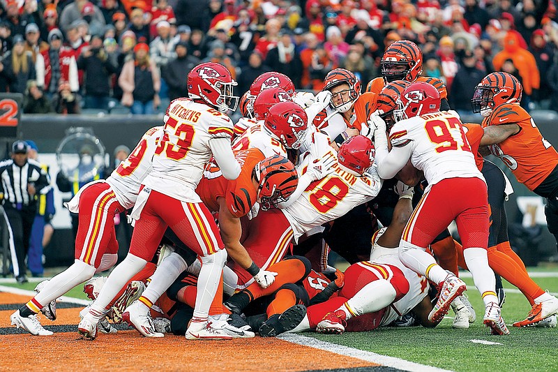 Bengals quarterback Joe Burrow (center right) is stopped short of the end zone late in Sunday afternoon’s game against the Chiefs in Cincinnati. (Associated Press)