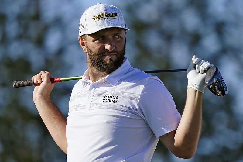 Jon Rahm, of Spain, waits to hit on the 13th tee during the Tournament of Champions pro-am team play golf event, Wednesday, Jan. 5, 2022, , at Kapalua Plantation Course in Kapalua, Hawaii. (AP Photo/Matt York)