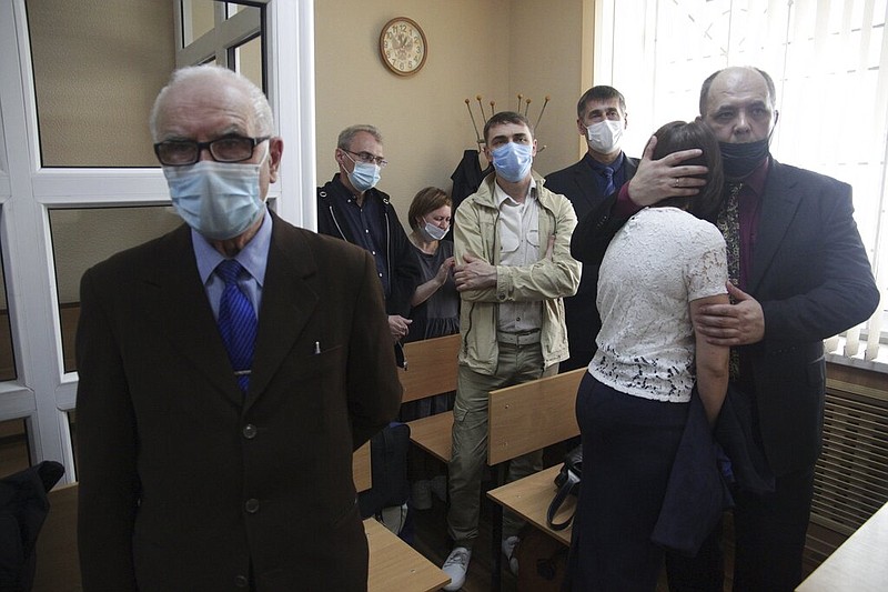 Members of the Jehovah's Witnesses attend a court session in Perm, Russia, in this May 12, 2021, file photo. Five members of the Jehovah's Witnesses were handed suspended sentences of between 2 1/2 and 7 years during the court hearing in connection with their beliefs. Russia banned the Jehovah's Witnesses in 2017 and declared it an extremist group, exposing all of its followers to prosecution. (AP/Anastasia Yakovleva)
